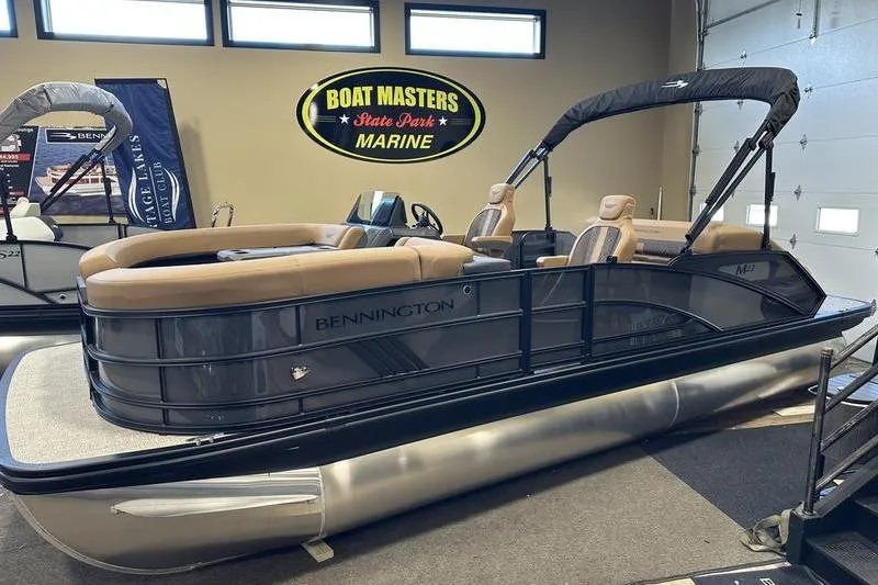 The Image of 2026 Bennington M Swingback 22 MSB pontoon boat displayed indoors at Boat Masters Marine. - 1