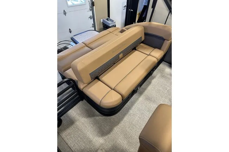 Slide: The Image of 2026 Bennington M Swingback 22 MSB boat interior with tan seating and modern design. - 14