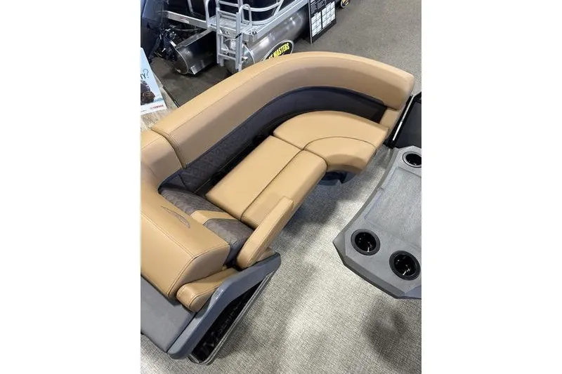 Slide: The Image of 2026 Bennington M Swingback 22 MSB boat interior with tan and gray seating. - 15