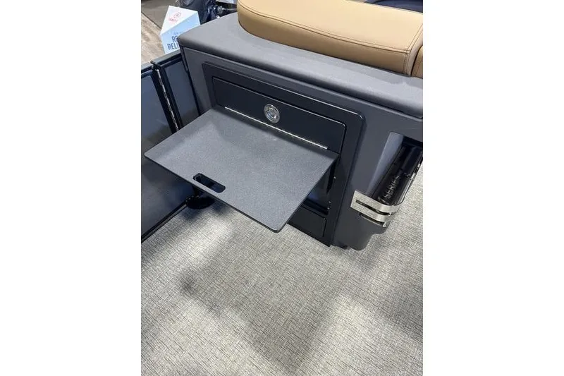 Slide: The Image of 2026 Bennington M Swingback 22 MSB storage compartment with fold-out tray. - 17