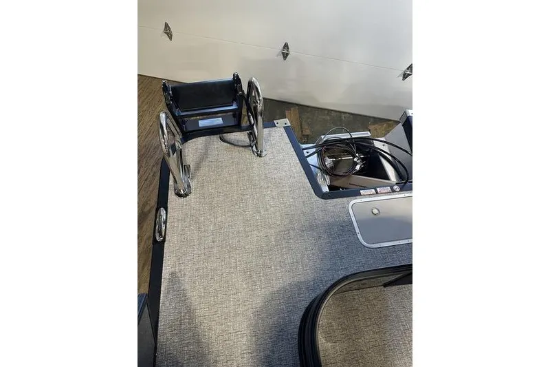 Slide: The Image of 2026 Bennington M Swingback 22 MSB boat deck with ladder and storage compartments. - 20