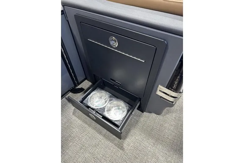 Slide: The Image of Storage compartment with drawer open, showcasing cup holders in 2026 Bennington M Swingback 22 MSB. - 21