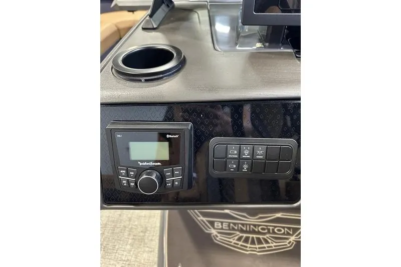 Slide: The Image of Control panel of 2026 Bennington M Swingback 22 MSB with audio system and cup holder. - 23