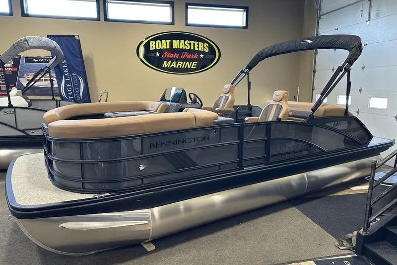 Slide: The Image of 2026 Bennington M Swingback 22 MSB pontoon boat displayed indoors at Boat Masters Marine. - 3
