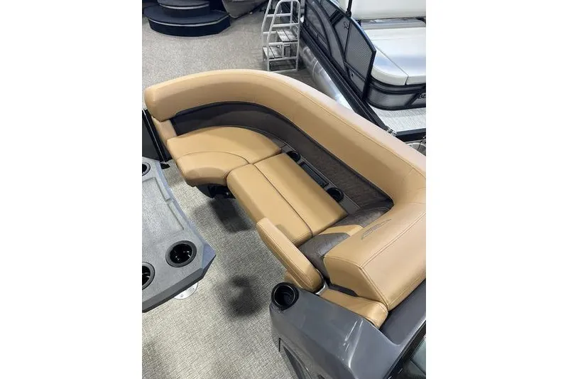 Slide: The Image of Luxurious seating on 2026 Bennington M Swingback 22 MSB pontoon boat, featuring tan upholstery. - 5