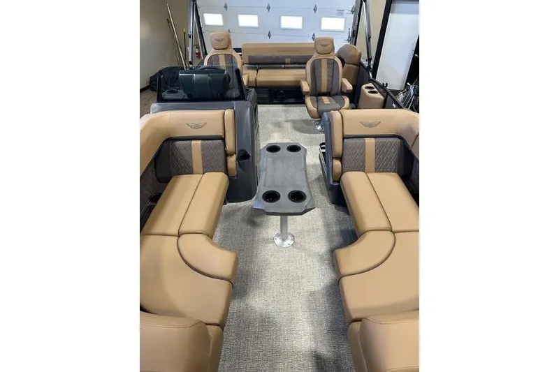 Slide: The Image of 2026 Bennington M Swingback 22 MSB interior with luxurious tan seating and central table. - 9