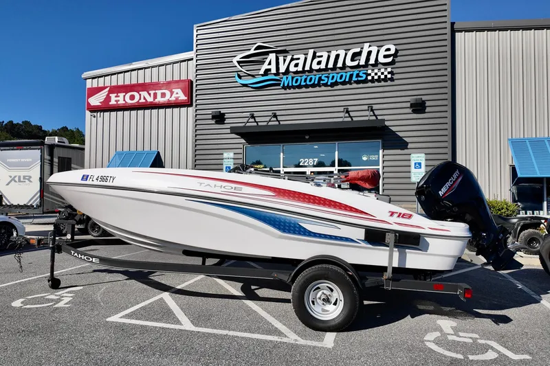 The Image of 2024 Tahoe T18 boat on trailer at Avalanche Motorsports dealership. - 0