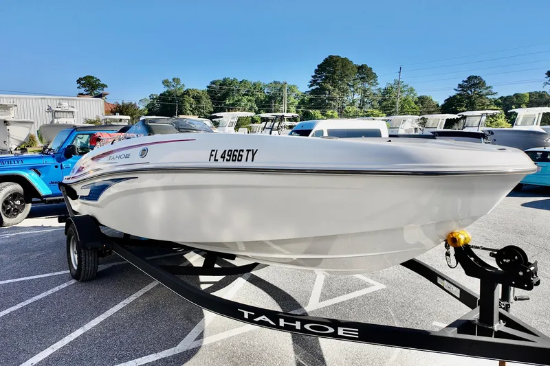 Slide: The Image of 2024 Tahoe T18 boat on trailer in parking lot, sunny day. - 4