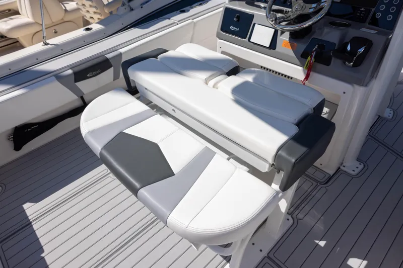 Slide: The Image of 2023 Robalo 266 Cayman boat interior with sleek seating and modern console design. - 10