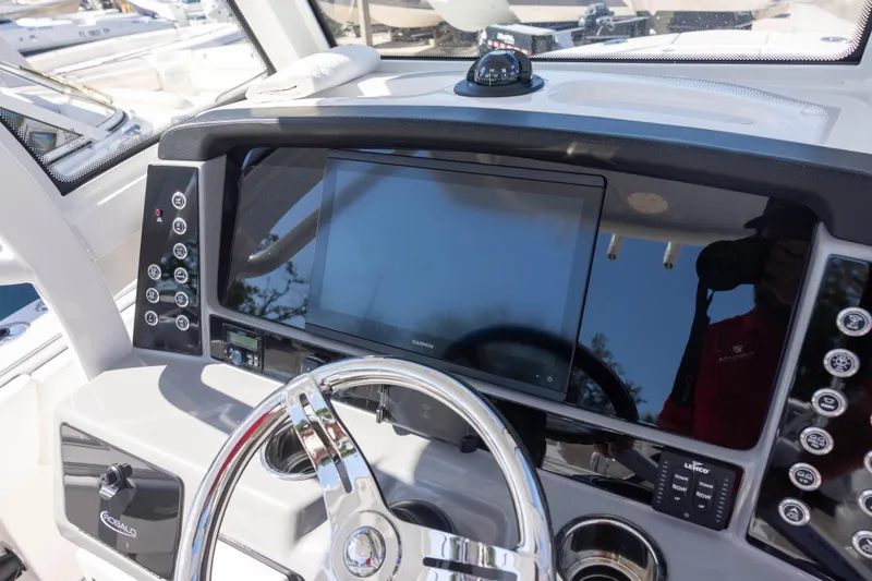 Slide: The Image of Dashboard of 2023 Robalo 266 Cayman boat with modern controls and navigation system. - 12