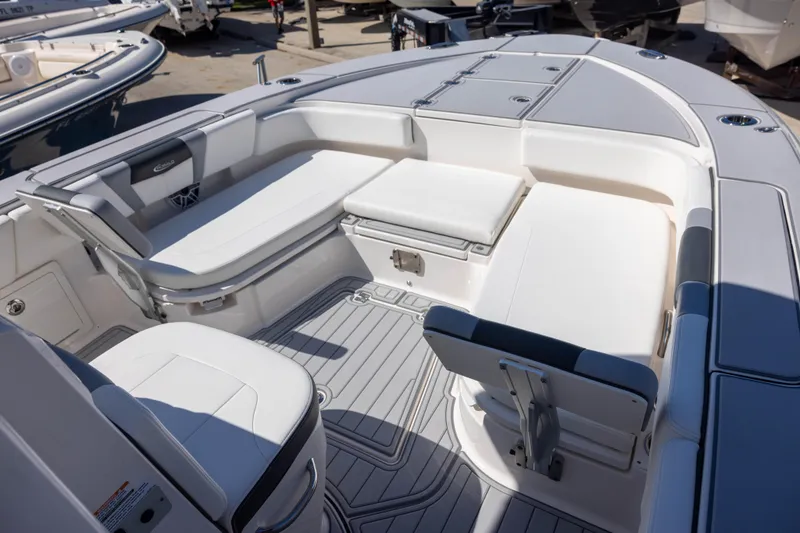 Slide: The Image of 2023 Robalo 266 Cayman boat interior with spacious seating and sleek design. - 13