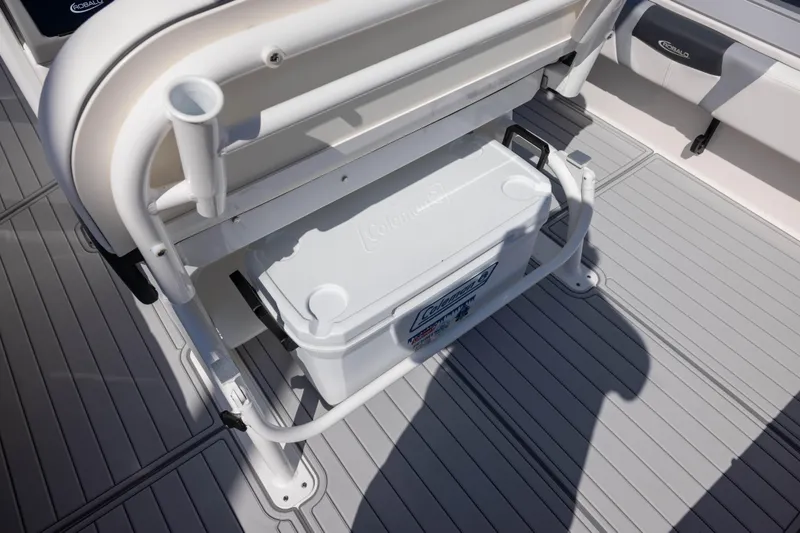 Slide: The Image of 2023 Robalo 266 Cayman boat deck with Coleman cooler storage. - 7