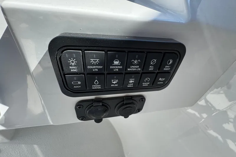Slide: The Image of Control panel of 2026 Stingray 211 DC boat with various function buttons. - 15