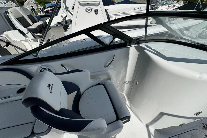 Slide: The Image of Interior of 2026 Stingray 211 DC boat, featuring sleek seating and modern design elements. - 17