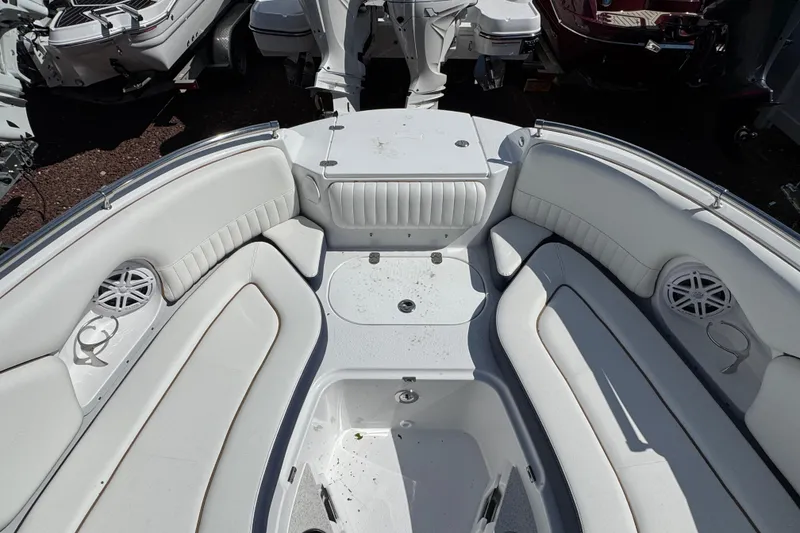 Slide: The Image of 2026 Stingray 211 DC boat interior with white seating and speakers. - 24