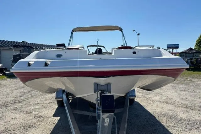 Slide: The Image of 2016 Hurricane SunDeck Sport 188 OB boat on trailer, front view, sunny day. - 18