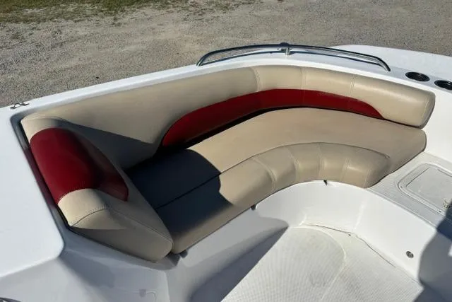 Slide: The Image of 2016 Hurricane SunDeck Sport 188 OB boat with beige and red cushioned seating. - 21