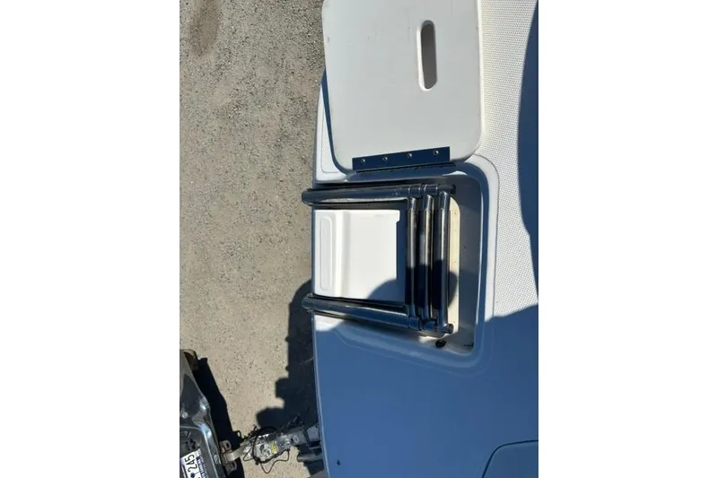 Slide: The Image of Foldable ladder on a 2016 Hurricane SunDeck Sport 188 OB boat. - 26