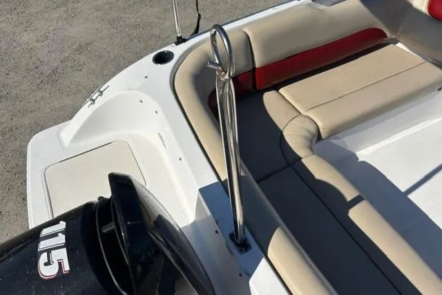 Slide: The Image of 2016 Hurricane SunDeck Sport 188 OB boat with beige seating and outboard motor. - 27