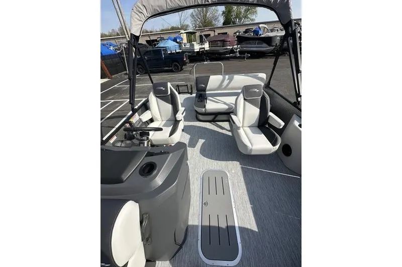 Slide: The Image of 2026 Bennington S Swingback 22 SSB pontoon boat interior with seating and helm. - 4