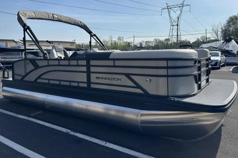 Slide: The Image of 2026 Bennington S Swingback 22 SSB pontoon boat in a parking lot. - 9