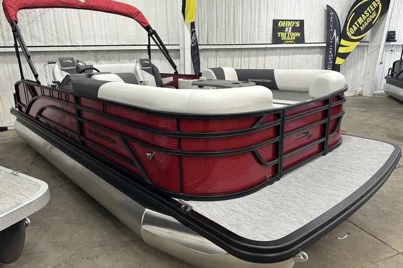 Slide: The Image of 2026 Bennington S Swingback 22 SSB pontoon boat with red exterior and spacious seating. - 11