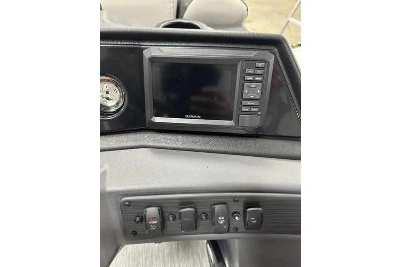 Slide: The Image of Dashboard of 2026 Bennington S Swingback 22 SSB with Garmin display and control switches. - 12