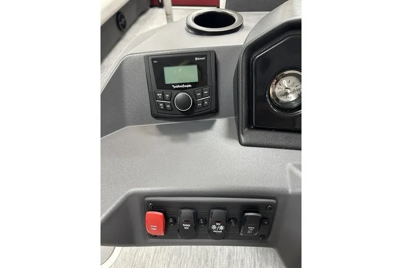 Slide: The Image of 2026 Bennington S Swingback 22 SSB dashboard with control panel and gauges. - 13