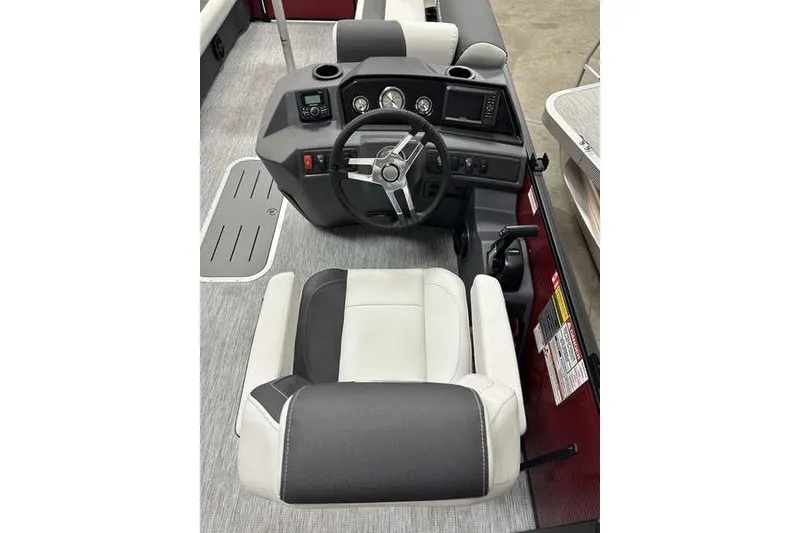 Slide: The Image of 2026 Bennington S Swingback 22 SSB boat interior with steering console and captain's chair. - 14
