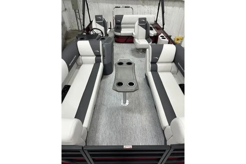 Slide: The Image of 2026 Bennington S Swingback 22 SSB pontoon boat interior with plush seating and cup holders. - 3