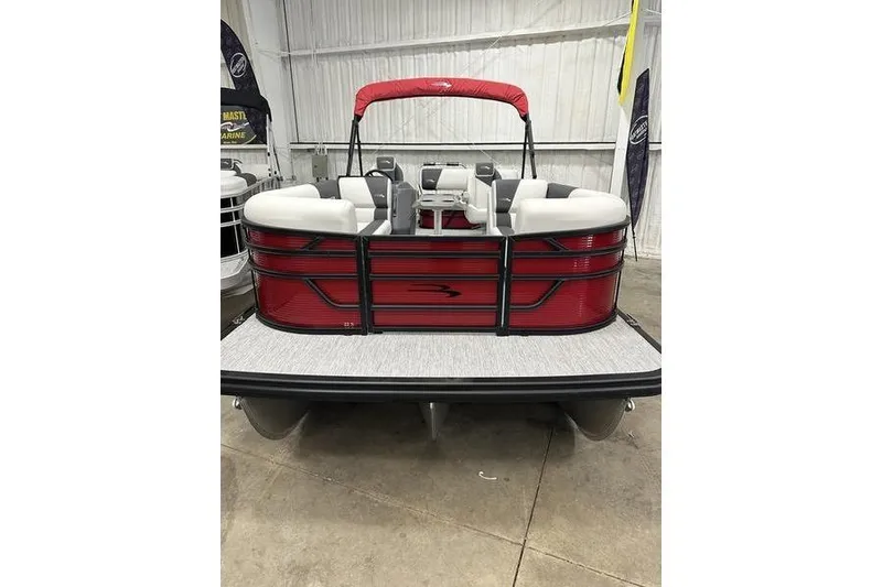 Slide: The Image of 2026 Bennington S Swingback 22 SSB pontoon boat with red exterior and white seating. - 7