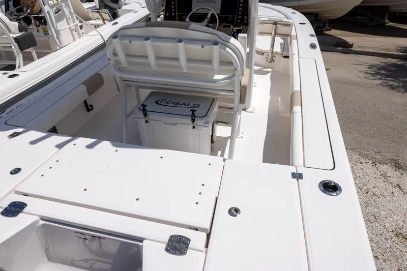 Slide: The Image of 2025 Robalo 246 Cayman boat interior with seating and storage compartments. - 3