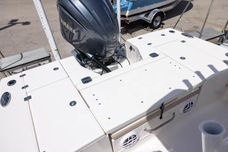 Slide: The Image of 2025 Robalo 246 Cayman boat with Yamaha engine, featuring spacious deck and storage compartments. - 4