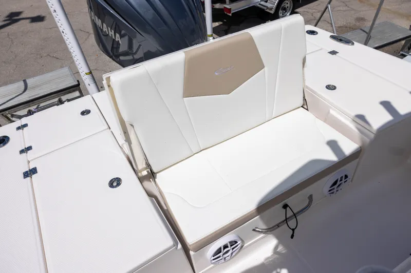 Slide: The Image of 2025 Robalo 246 Cayman boat seat with Yamaha engine in background. - 7