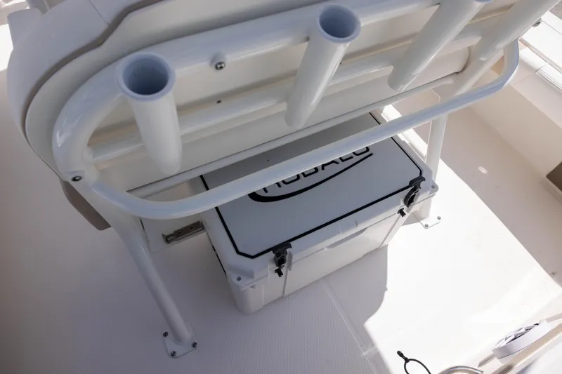 Slide: The Image of 2025 Robalo 246 Cayman boat interior with rod holders and storage compartment. - 8