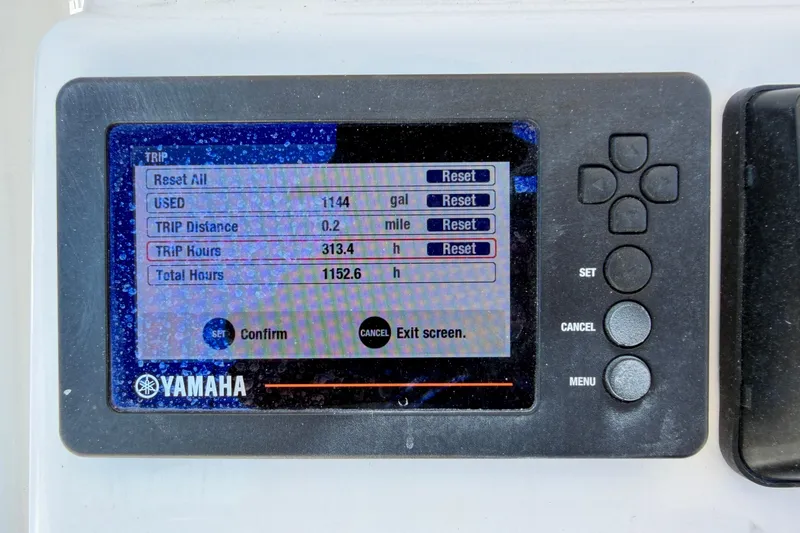 Slide: The Image of Yamaha display showing trip data on a 2022 Century 2301 Center Console boat. - 19