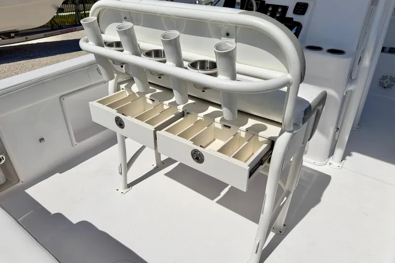Slide: The Image of 2022 Century 2301 Center Console boat with rod holders and storage drawers. - 24