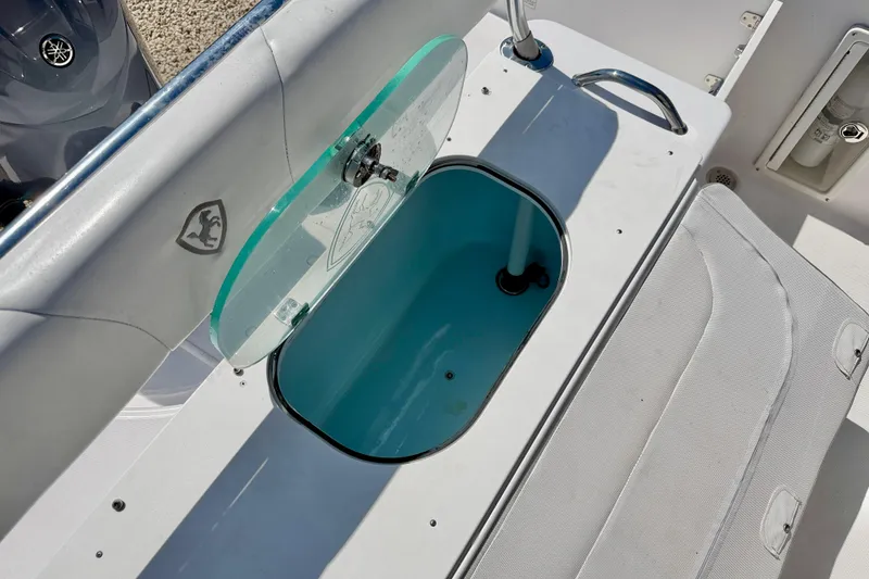 Slide: The Image of Century 2301 Center Console 2022 boat with open livewell and seating area. - 26