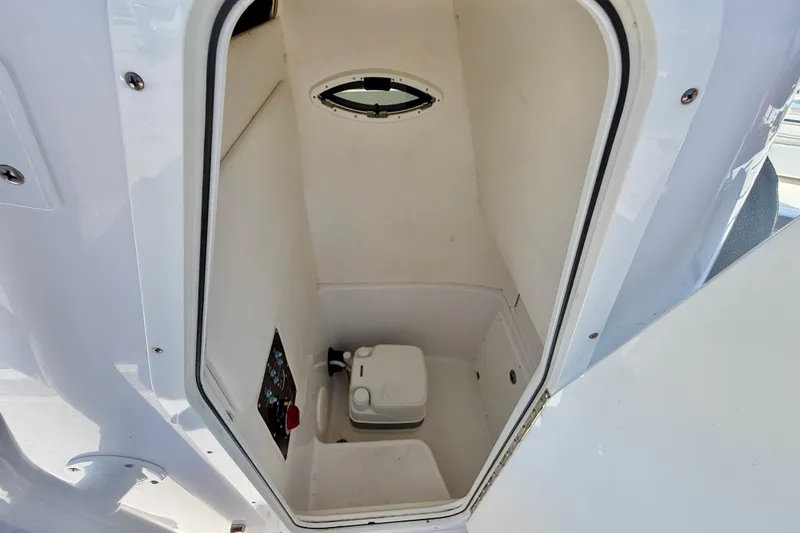 Slide: The Image of Interior view of 2022 Century 2301 Center Console boat's compact restroom. - 28