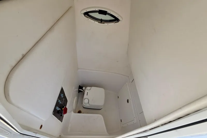 Slide: The Image of Interior of 2022 Century 2301 Center Console boat with compact marine toilet. - 29