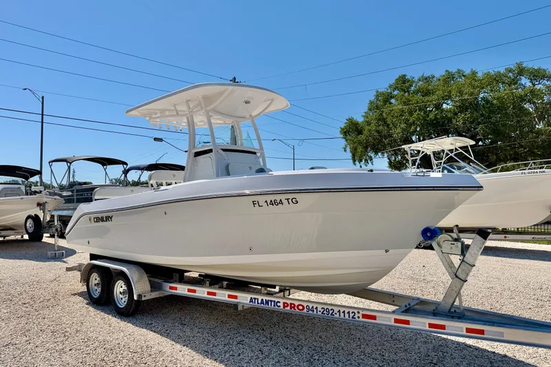Slide: The Image of 2022 Century 2301 Center Console boat on trailer, displayed outdoors. - 3