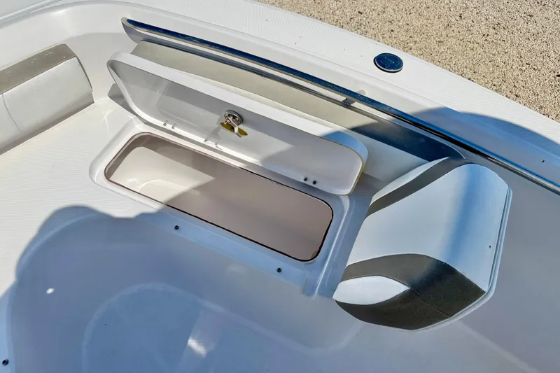 Slide: The Image of Open storage compartment on 2022 Century 2301 Center Console boat deck. - 30