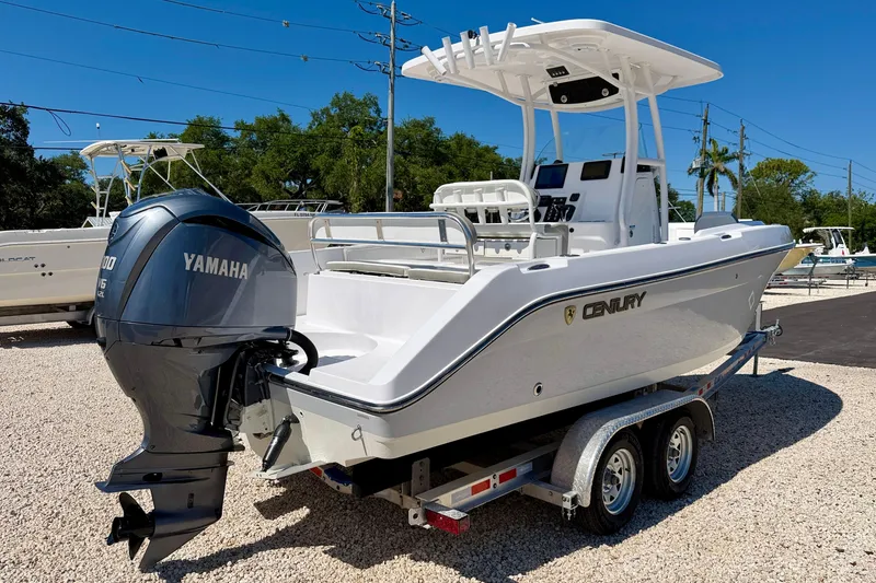 Slide: The Image of 2022 Century 2301 Center Console boat with Yamaha engine on trailer, parked outdoors. - 5