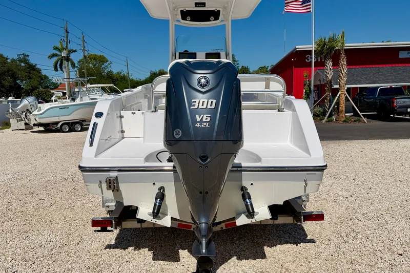 Slide: The Image of 2022 Century 2301 Center Console boat with Yamaha 300 V6 engine, displayed outdoors. - 6