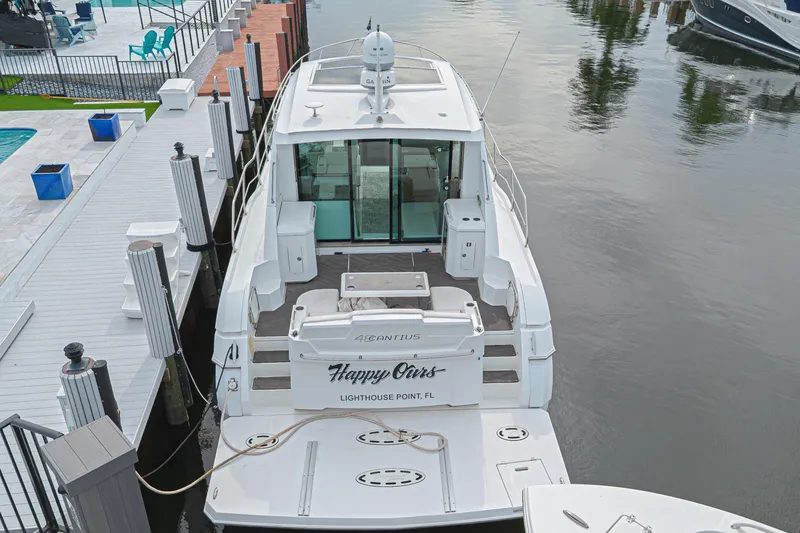 Slide: The Image of 2012 Cruisers Yachts 48 Cantius docked, rear view, in Lighthouse Point, FL marina. - 13