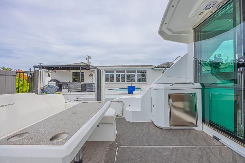 Slide: The Image of 2012 Cruisers Yachts 48 Cantius deck with modern amenities and outdoor seating. - 16