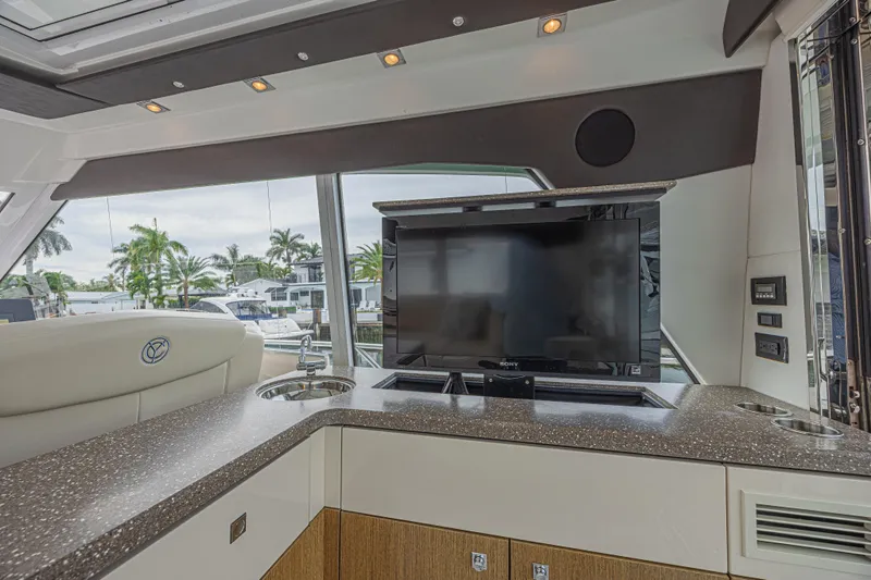 Slide: The Image of Luxurious interior of 2012 Cruisers Yachts 48 Cantius with TV and modern amenities. - 21