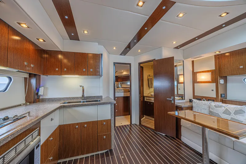 Slide: The Image of Luxurious interior of 2012 Cruisers Yachts 48 Cantius with modern kitchen and seating area. - 33