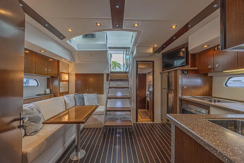 Slide: The Image of Luxurious interior of 2012 Cruisers Yachts 48 Cantius with modern kitchen and seating area. - 35