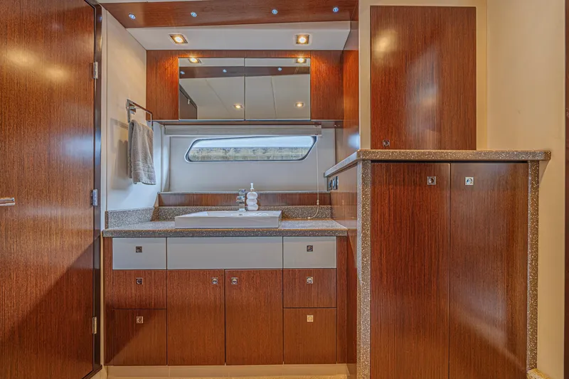 Slide: The Image of Luxurious bathroom interior of 2012 Cruisers Yachts 48 Cantius with wood cabinetry and modern fixtures. - 38